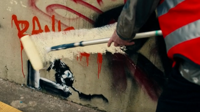 Christopher Walken paints over a Banksy paiting. Pic: BBC