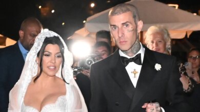 Travis Barker kisses Kourtney Kardashian's feet in new wedding photos