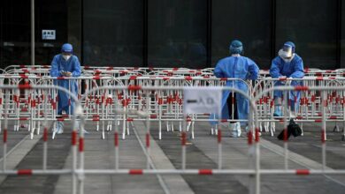 Live news updates: China expands restrictions as cities struggle to contain Covid-19 infections