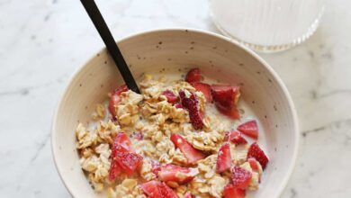 overnight oatmeal in a bowl with chopped strawberries