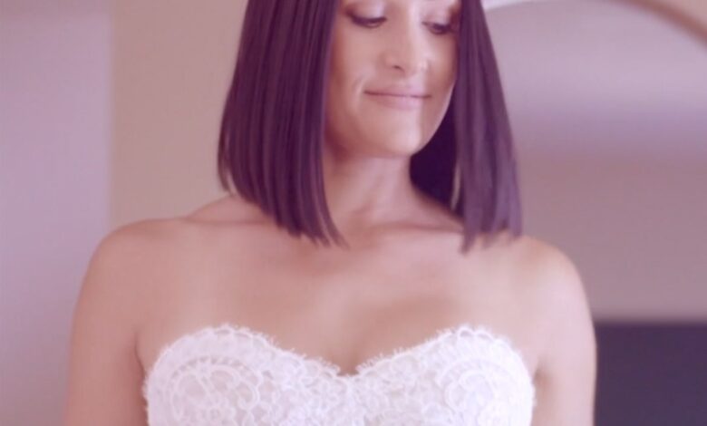 Watch Nikki Bella try on her gorgeous wedding dress