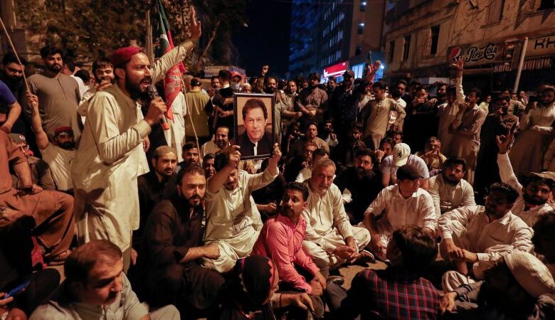 Imran Khan: Former Pakistani PM greets supporters outside home after police arrest operation ends in chaos