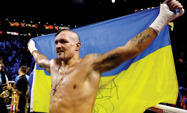 JEDDAH, SAUDI ARABIA - AUGUST 20: Oleksandr Usyk celebrates with a flag of Ukraine after their victory over Anthony Joshua in their World Heavyweight Championship fight during the Rage on the Red Sea Heavyweight Title Fight at King Abdullah Sports City Arena on August 20, 2022 in Jeddah, Saudi Arabia. (Photo by Francois Nel/Getty Images)