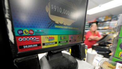 A display for the Mega Millions lottery is seen at the Save 'N Time convenience store in Harahan, La., Wednesday, July 26, 2023. The Mega Millions lottery jackpot reached $1 billion ahead of Friday’s drawing. (AP Photo/Gerald Herbert)